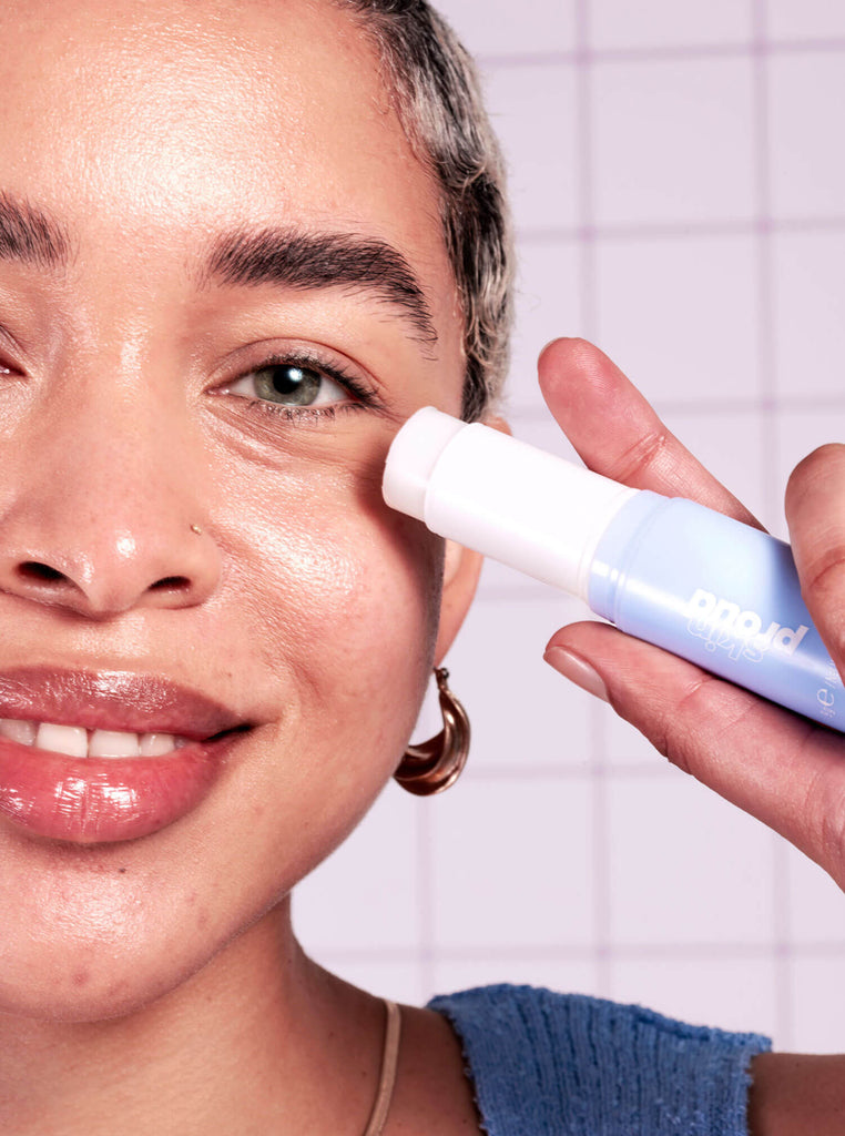 Model applying Icicle eye balm to undereyes